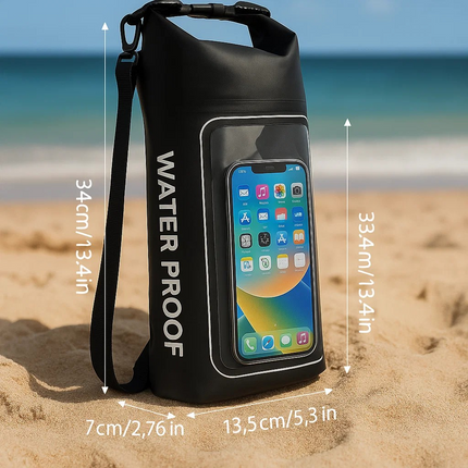 Black waterproof bag with phone pocket on a sandy beach with ocean view