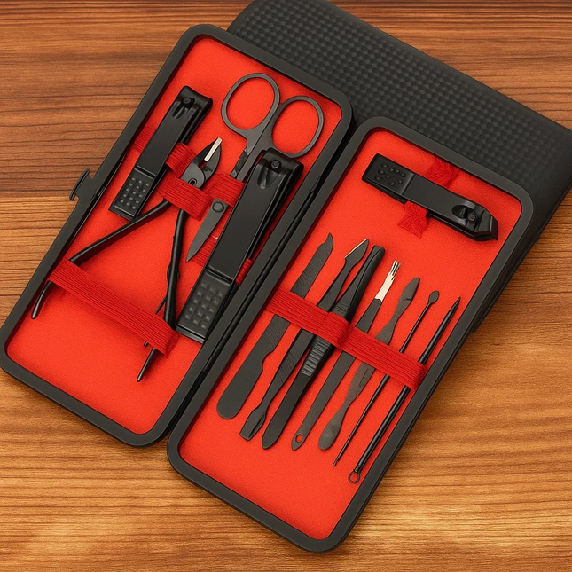 Manicure set with black tools on a red interior case, placed on a wooden surface.