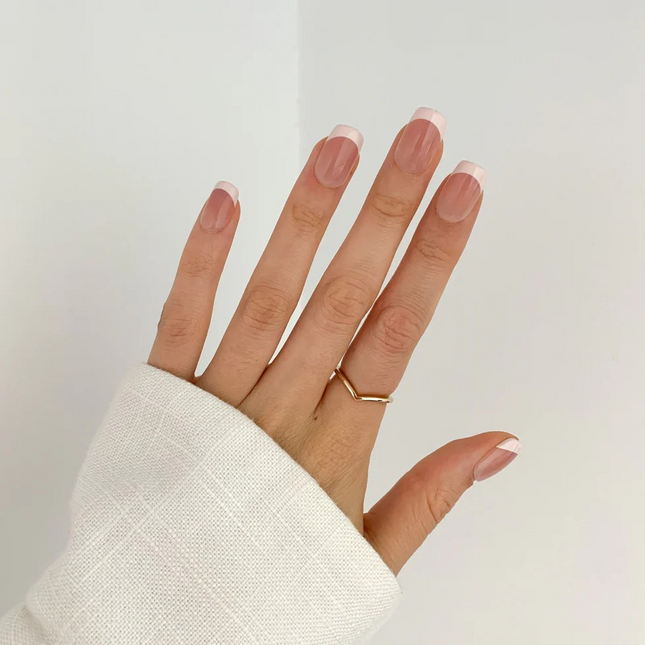 White Tip french press on gel nails on a hand in new zealand