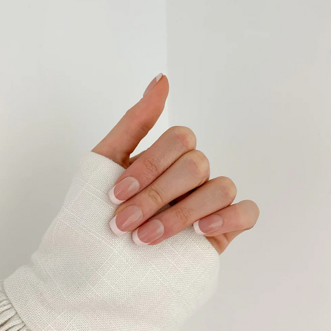 White Tip french press on gel nails on a hand in nz