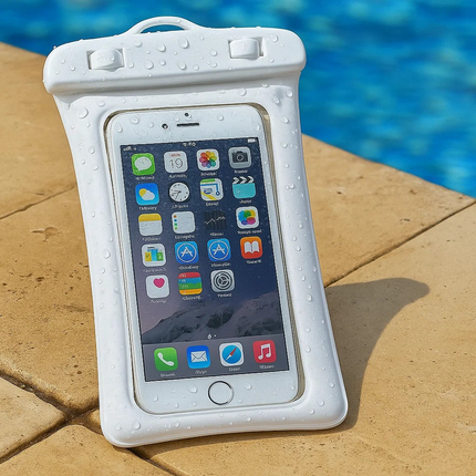 White waterproof phone case with a smartphone inside, placed on a poolside surface.