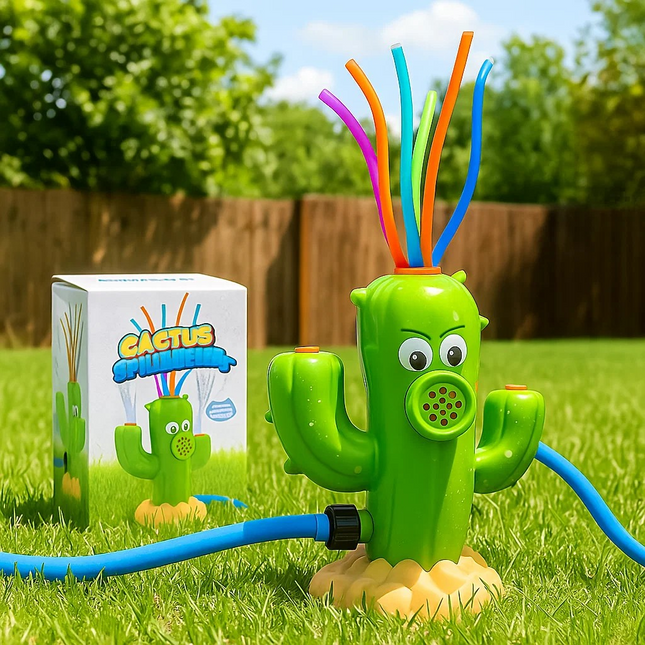 Cactus-shaped sprinkler with colorful nozzles on grass, next to its packaging.
