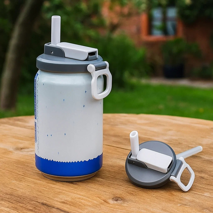 can lid with straw on wooden table