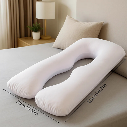 White U-shaped pillow on a bed with measurements displayed new zealand in nz