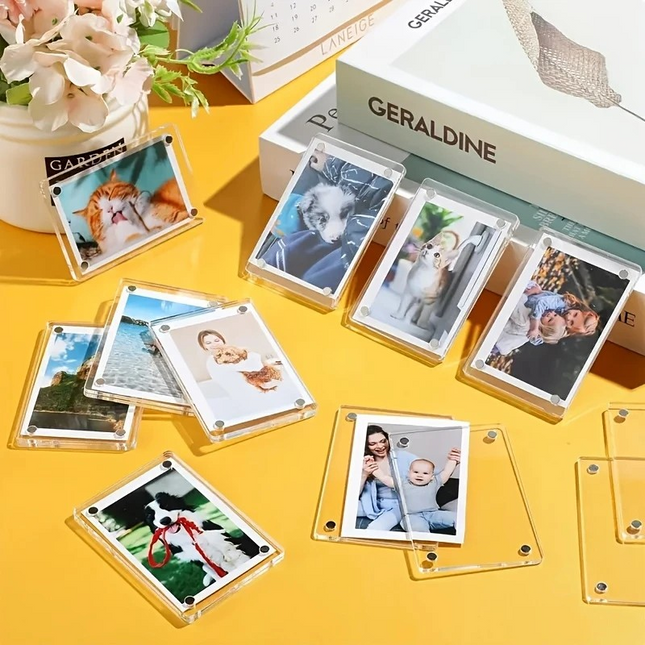 Magnetic fridge photo frames holding kids' drawings and family photos