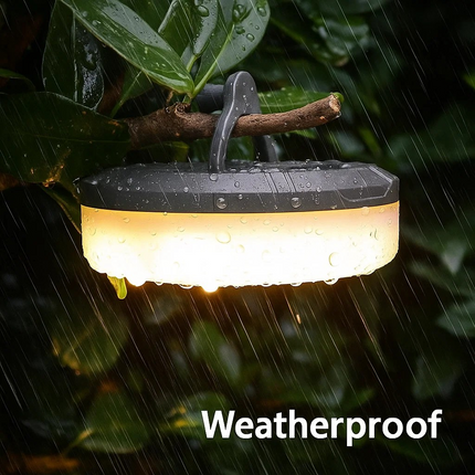 Weatherproof outdoor light hanging from a branch with raindrops on leaves.